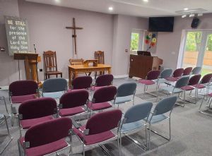 Seating ready for worship inside the church