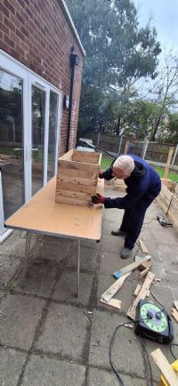A volunteer working in the garden